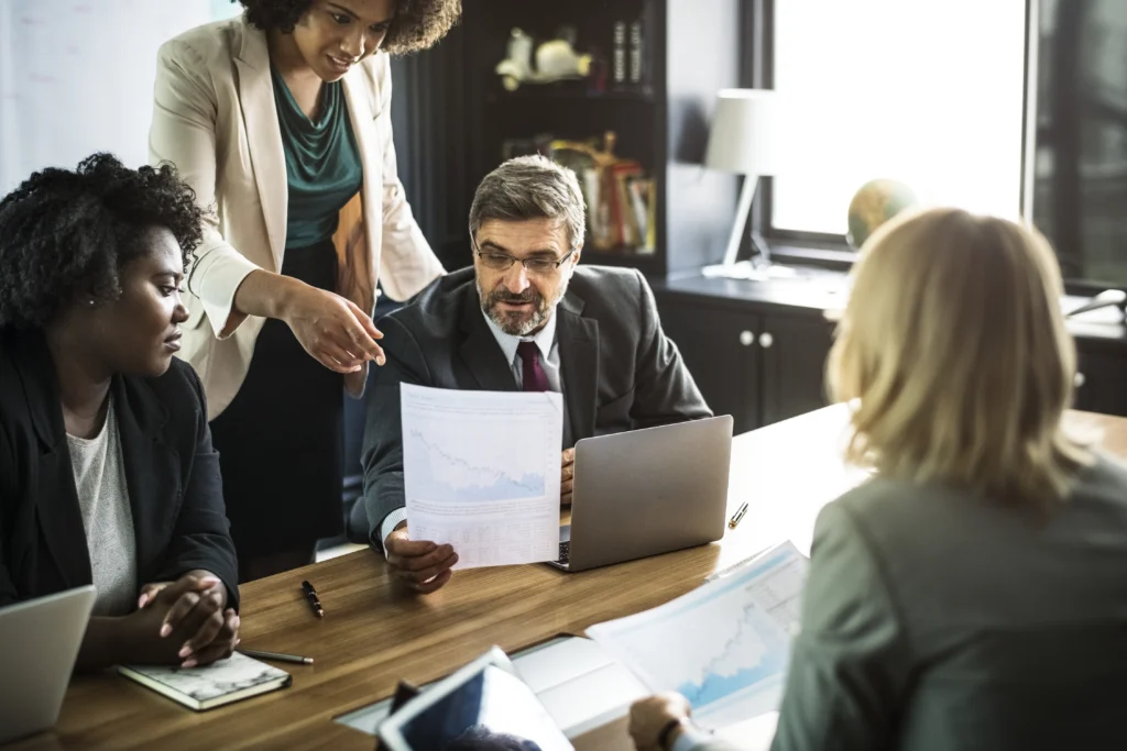Legal professionals reviewing documents during a client intake meeting