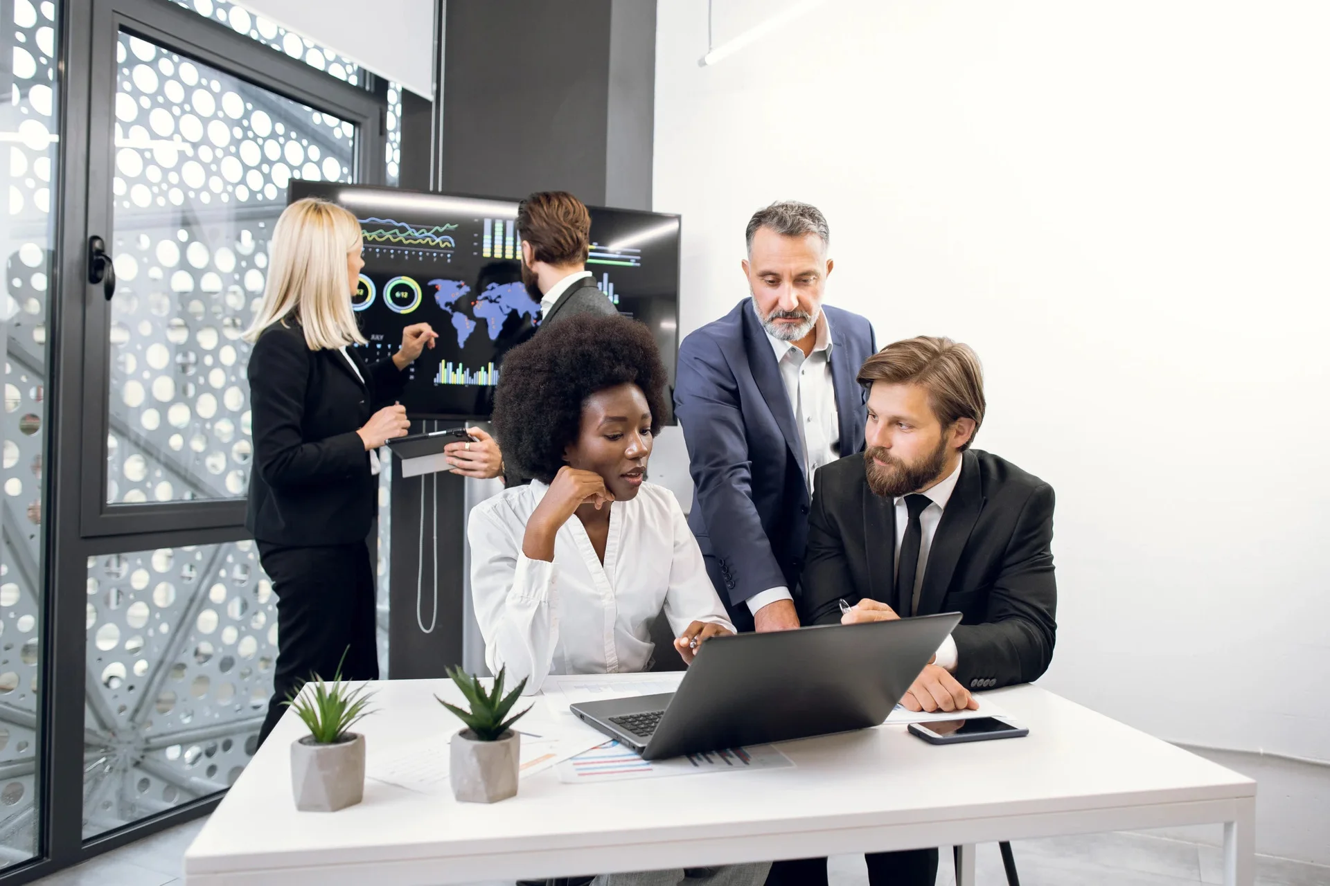Outsourcing Business Solutions: The Smart Way to Scale & Succeed 3 full concentration at work group of multiracial b 2024 12 10 03 56 48 utc scaled 1