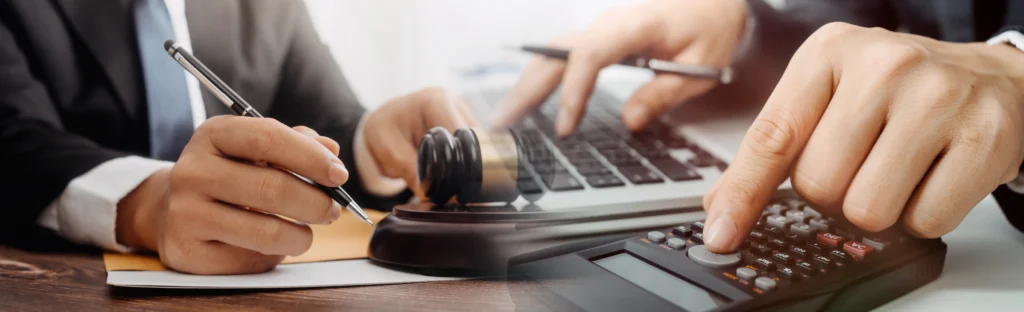 Professional reviewing financial documents for law firm accounts receivable