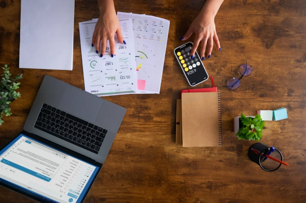 Payroll professional reviewing compliance requirements and financial records