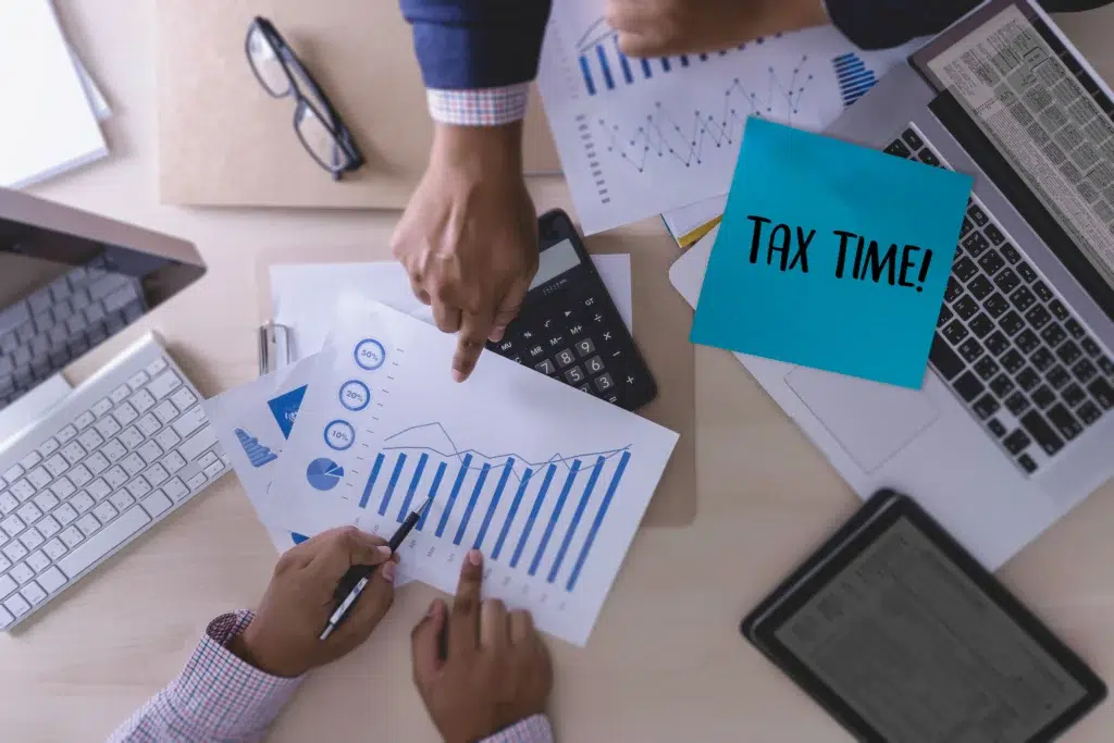 E-commerce Tax Solutions: How Online Businesses Simplify Sales Tax 2 E-commerce business owner reviewing multi-state tax obligations with a sales tax compliance outsourcing specialist.