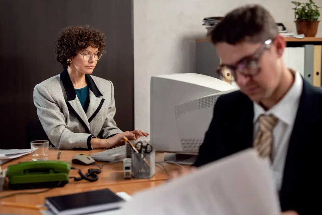 How Virtual Paralegals Are Revolutionizing Law Firm Operations 2 vintage style people working office with computers