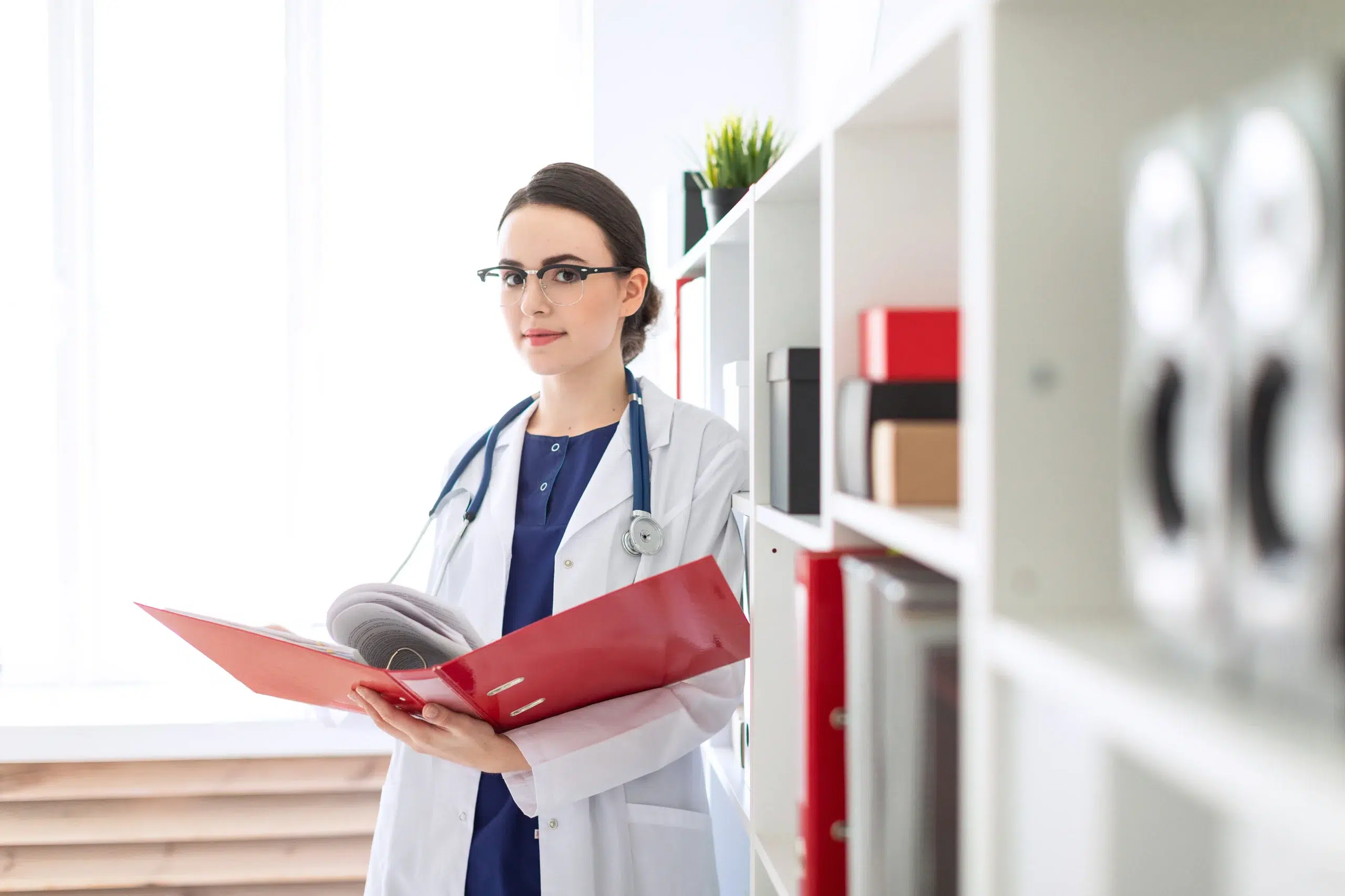 Doctor verifying medical records to ensure accurate 99212 CPT code reporting.