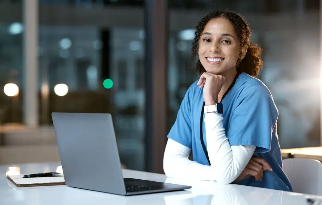Healthcare provider reviewing modifier 95 requirements on a computer