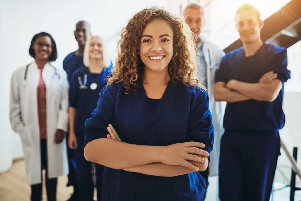 Smiling healthcare professional representing medical billing services for small practices. | Vinali