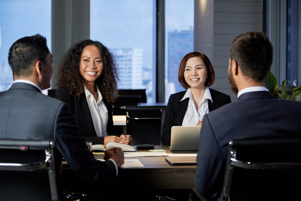 Diverse legal team meeting in a modern office, reflecting the cultural alignment and bilingual talent that sets nearshore legal process outsourcing companies apart