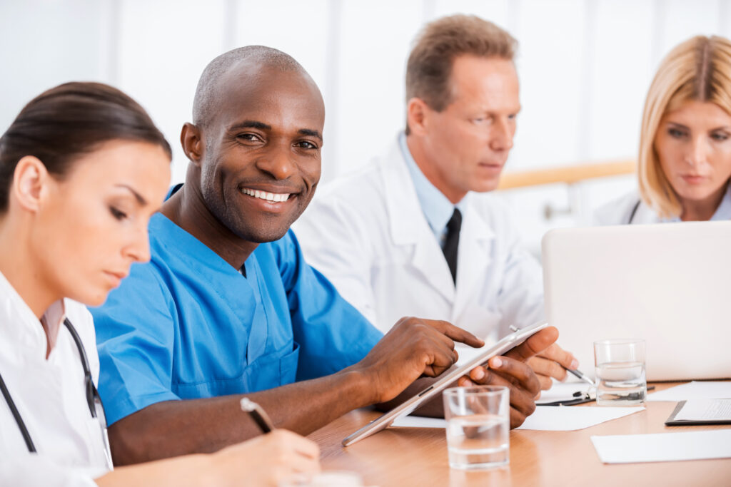 Outsourced Billing Services: What Healthcare Decision-Makers Need to Know Before Choosing a Partner 1 Medical professionals collaborating on outsourced billing services for healthcare practices