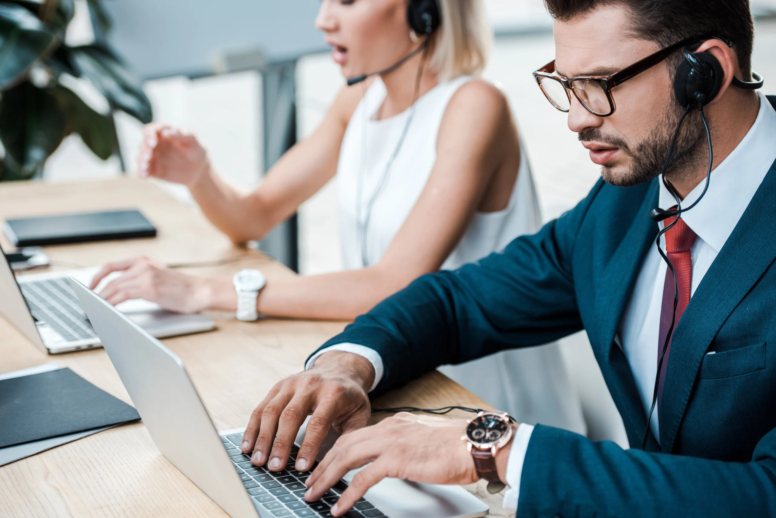 RCM outsourcing professionals collaborating with headsets, reflecting the fastest-growing healthcare business process outsourcing market