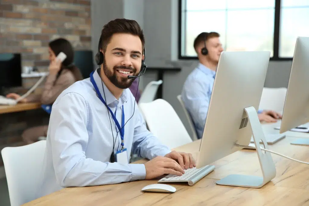 LATAM's Healthcare BPO Boom: The Numbers Behind the Fastest-Growing Outsourcing Market 3 Nearshore support specialist working with colleagues as part of a growing healthcare business process outsourcing team in Colombia