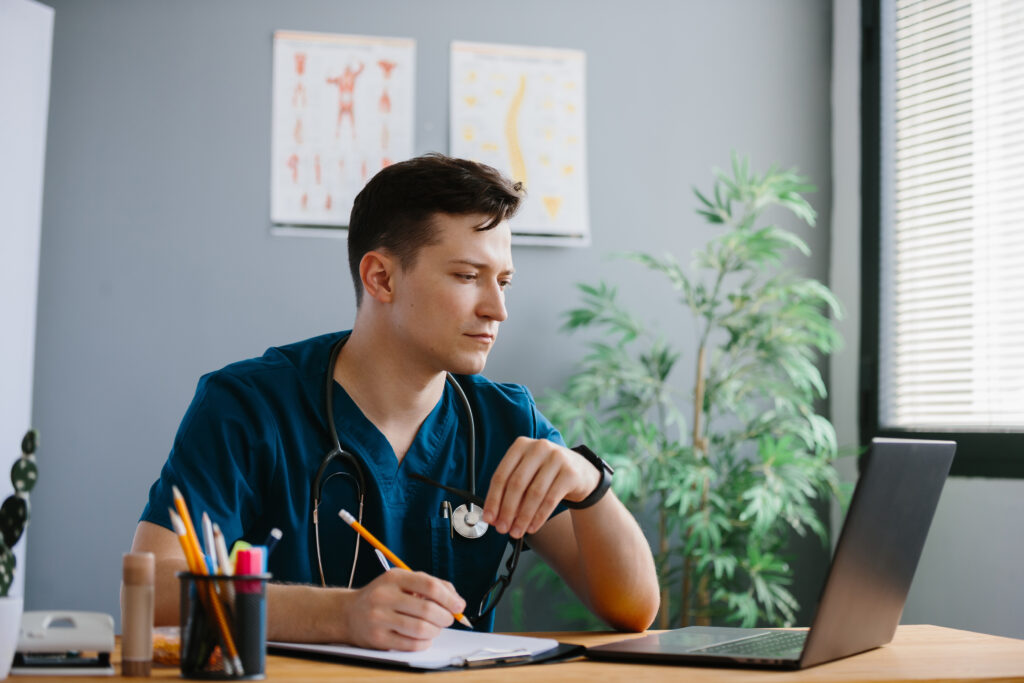 What Is an Intake Specialist in Healthcare RCM And Why Outsourcing This Role Is a Revenue Decision 3 Intake specialist documenting patient information and prior authorization requirements as part of a structured healthcare revenue cycle workflow