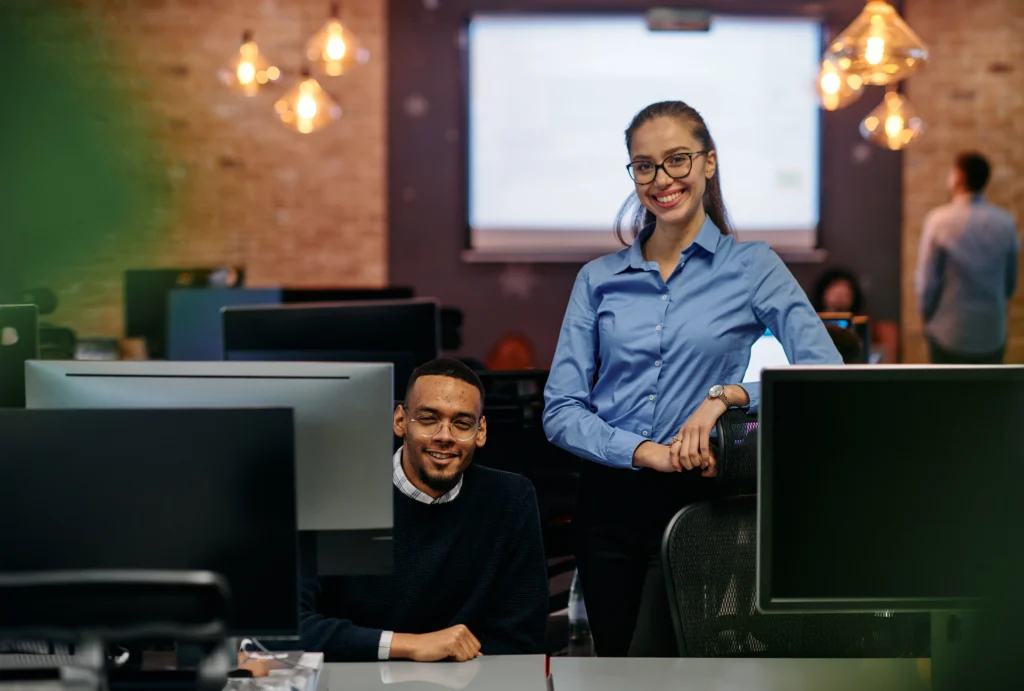 Are India and the Philippines Falling Behind in RCM Outsourcing? Here's What the Data Says 3 Nearshore RCM outsourcing team working in a modern office, managing U.S. healthcare billing operations during standard business hours