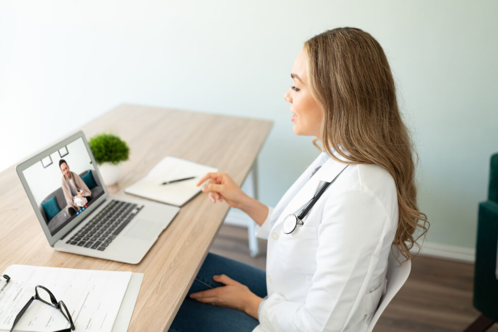 What Is an Intake Specialist in Healthcare RCM And Why Outsourcing This Role Is a Revenue Decision 1 Female patient intake specialist on a telemedicine call verifying eligibility and collecting demographic data for accurate claim submission