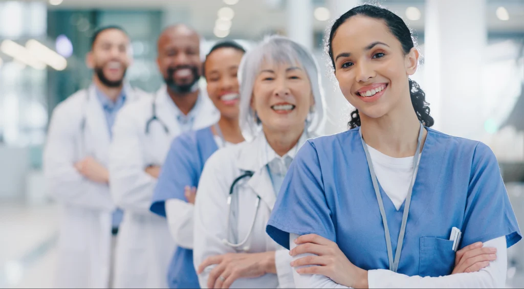 Group of medical professionals standing together, representing a health system supported by a single healthcare vendor management partner instead of multiple vendorsGroup of medical professionals standing together, representing a health system supported by a single healthcare vendor management partner instead of multiple vendors