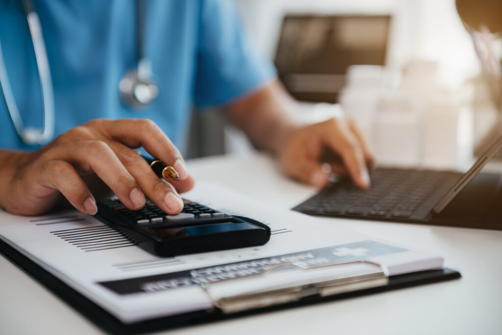 What Is an EOB in Medical Billing? How Explanation of Benefits Affects Your Revenue Cycle 2 Medical biller processing an explanation of benefits EOB at their desk, verifying payer payments and identifying underpayments in the revenue cycle