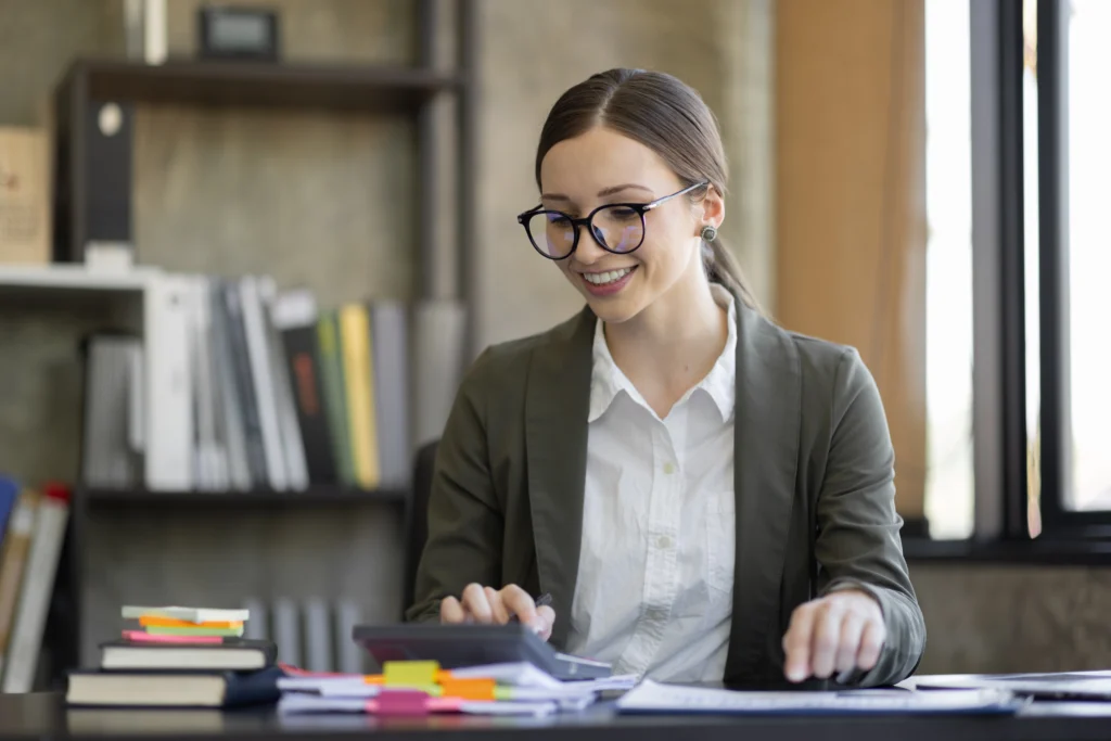 What an Accounts Receivable Specialist Does in Healthcare And Why Outsourcing This Role Protects Your Revenue 1 Smiling accounts receivable specialist reviewing aging claims, part of a nearshore team that helps practices outsource accounts receivable services