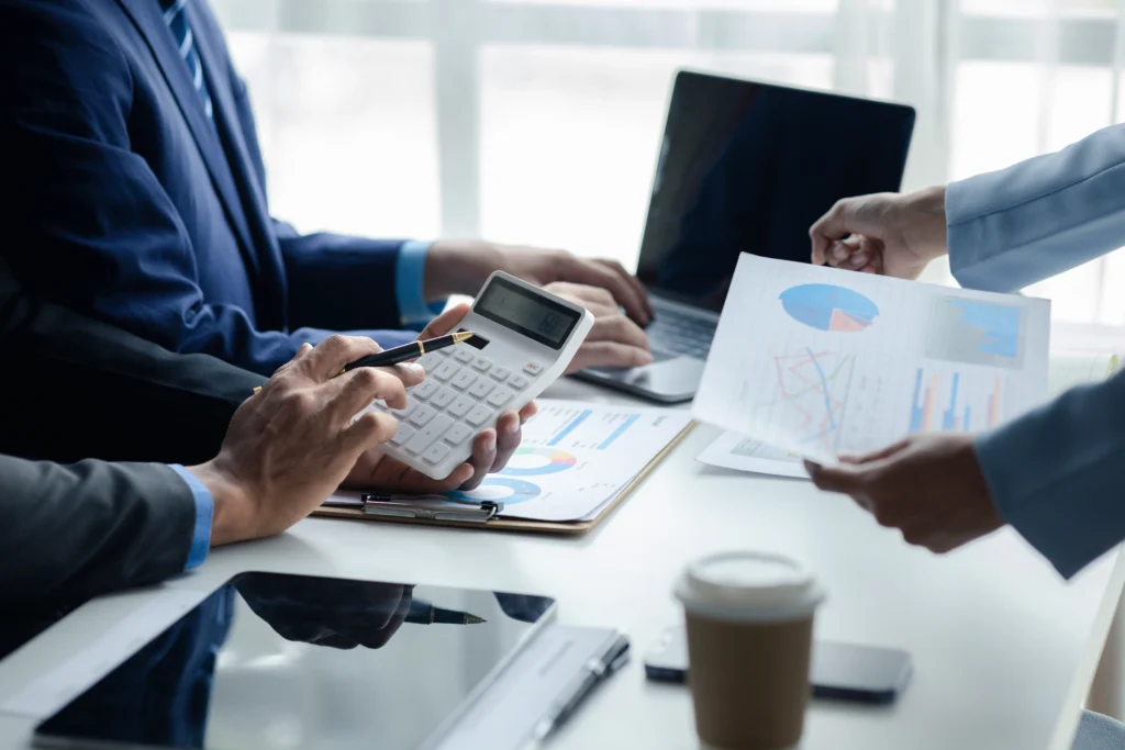 Finance professionals collaborating on accounting business process outsourcing tasks