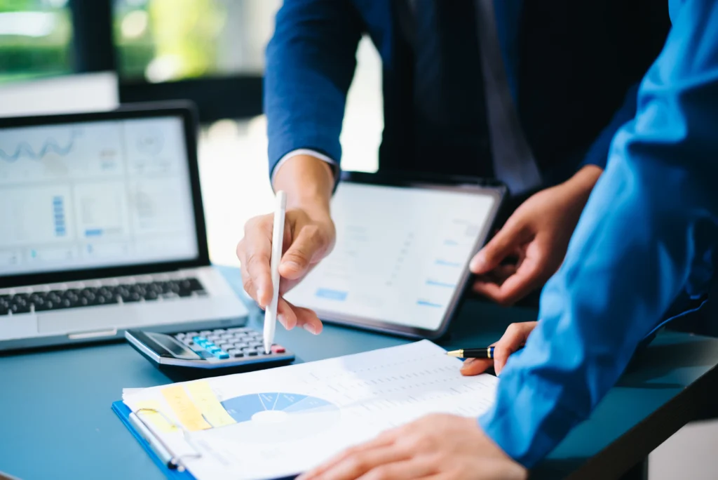 Business professionals analyzing financial data through accounting business process outsourcing