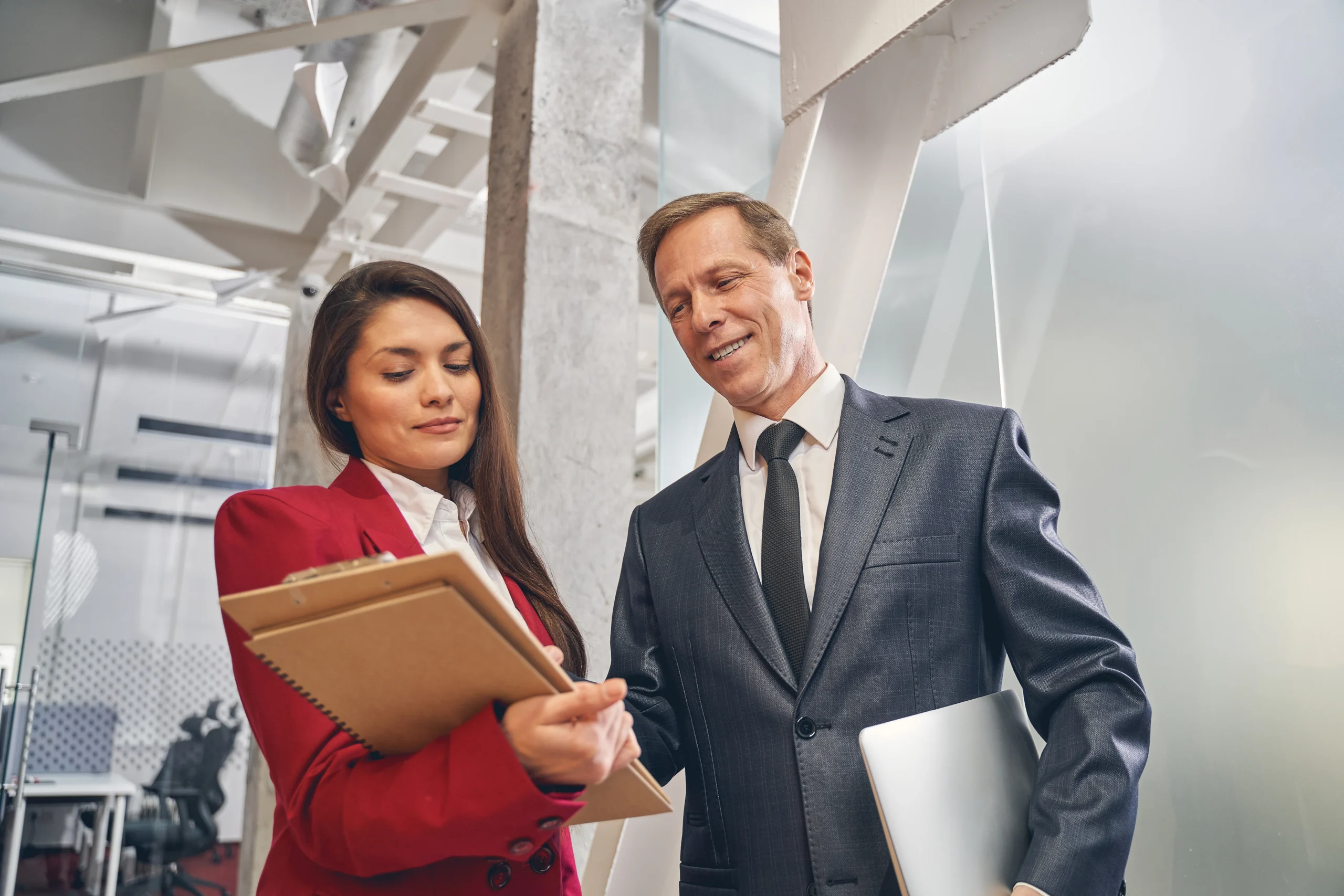 Business professionals reviewing a HIPAA compliance checklist for healthcare outsourcing