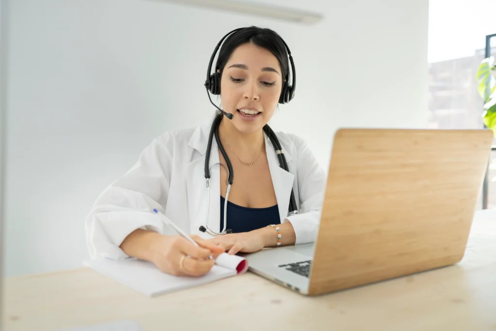 Doctor reviewing credentialing and payer enrollment during a telemedicine consultation