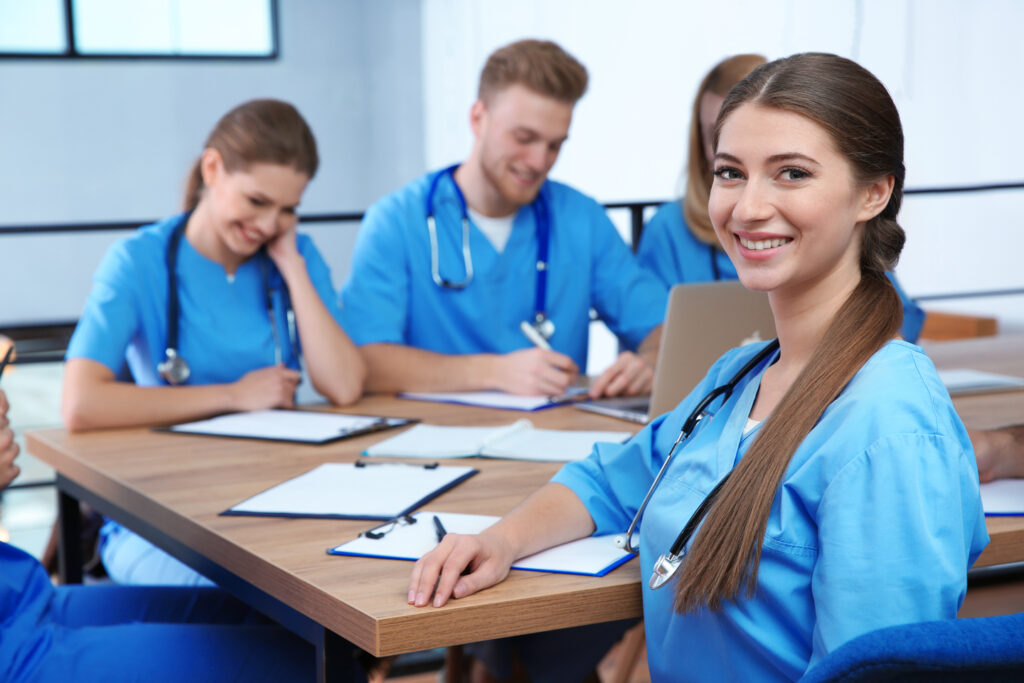 Outsourcing Nursing Services for Home Health: What It Costs and How to Get It Right 3 Medical professionals collaborating on care coordination as part of outsourcing nursing services