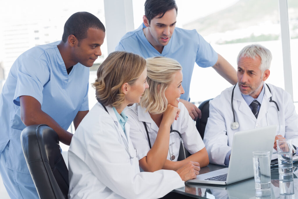 Medical professionals collaborating on claims, the kind of work outsourcing denial management services takes off their plate