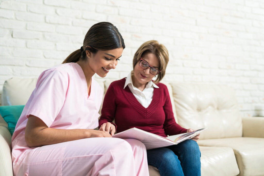 Caregiver placed through home care staffing solutions reviewing a care plan with a patient